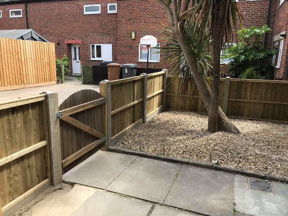 Fence, gate, patio and pebble/shingle front garden landscaping